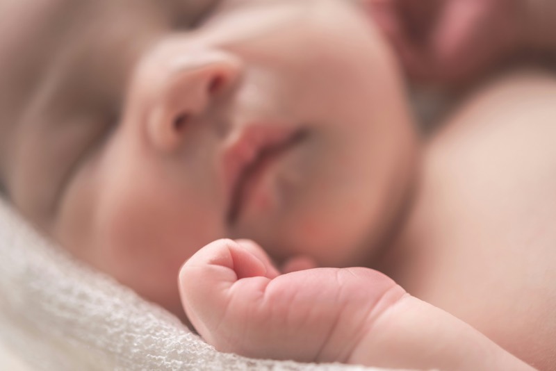 A newborn's hand, close up
